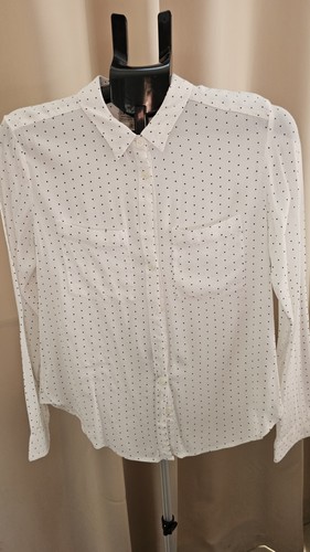 Ivory with black - with, spots